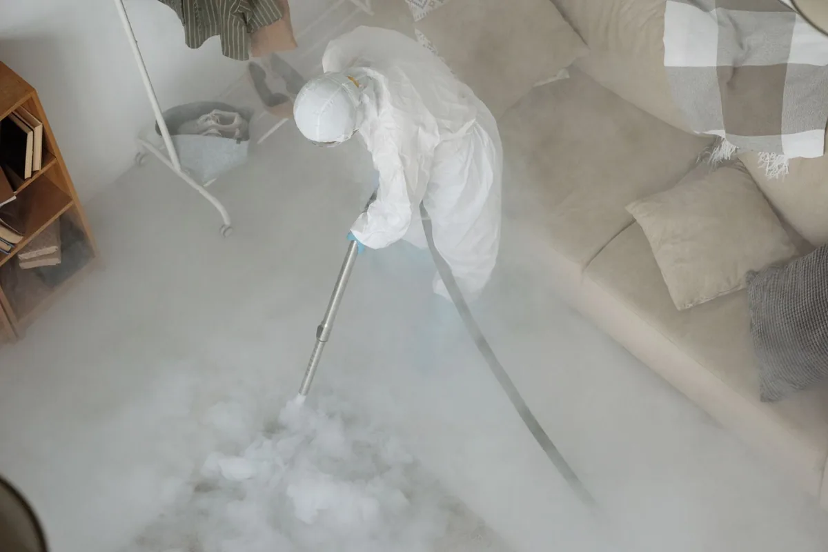 Biohazard cleanup technician in protective equipment, Jackson, TN